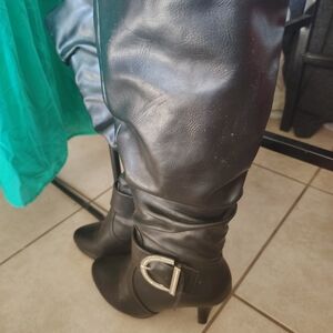 Sleek Black Heeled Boots with Silver Buckle